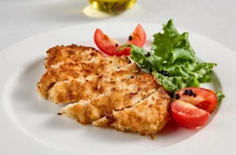 Сочная курица в хрустящей корочке из пармезана: легкий рецепт ужина, от которого будут в восторге все гости